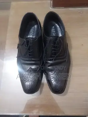 A pair of almost new original leather shoes for sale