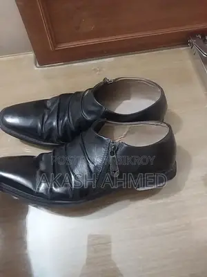 Pair of original leather shoes for sale.