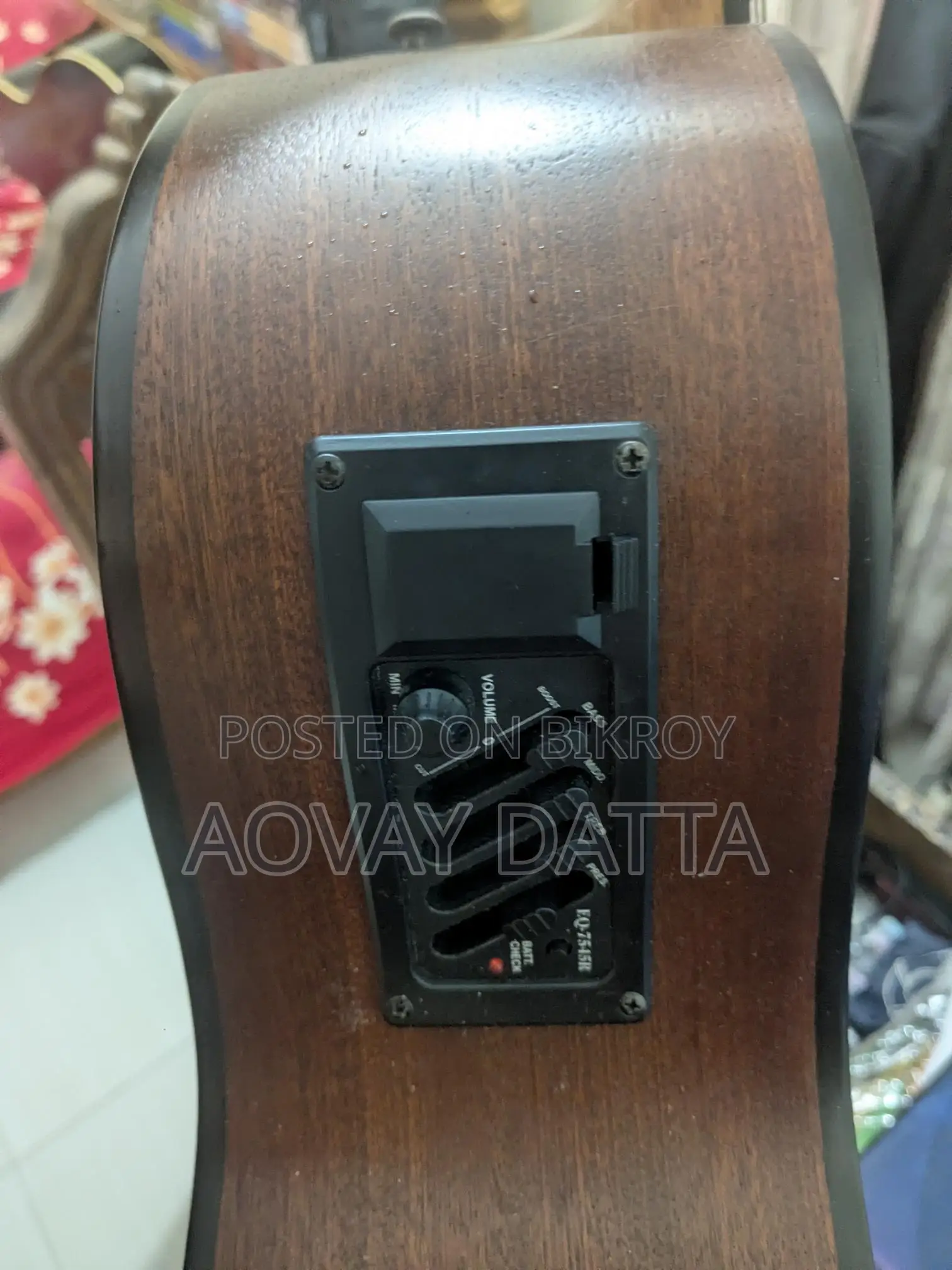 Acoustic guitar with equalizer.