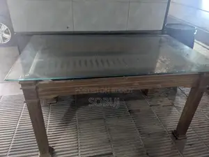 Dining Table 5 Ft by 3 with Glass Top Will Be Sold