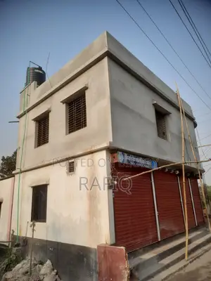 Urgent sale of a new two-story building with shop and garage.