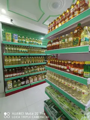 দোকানের Display Rack এর উপর “ বৈশাখী অফার—আজই অর্ডার করুন!”