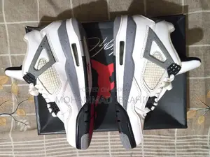 A pair of used branded sports sneakers for sale.