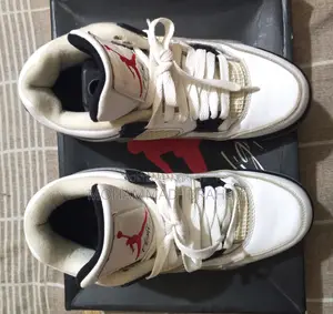 A pair of used branded sports sneakers for sale.