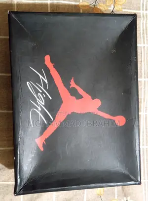 A pair of used branded sports sneakers for sale.