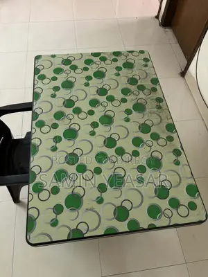 4 Seated Bengal Dining Table With An Arm Comfort Chair.