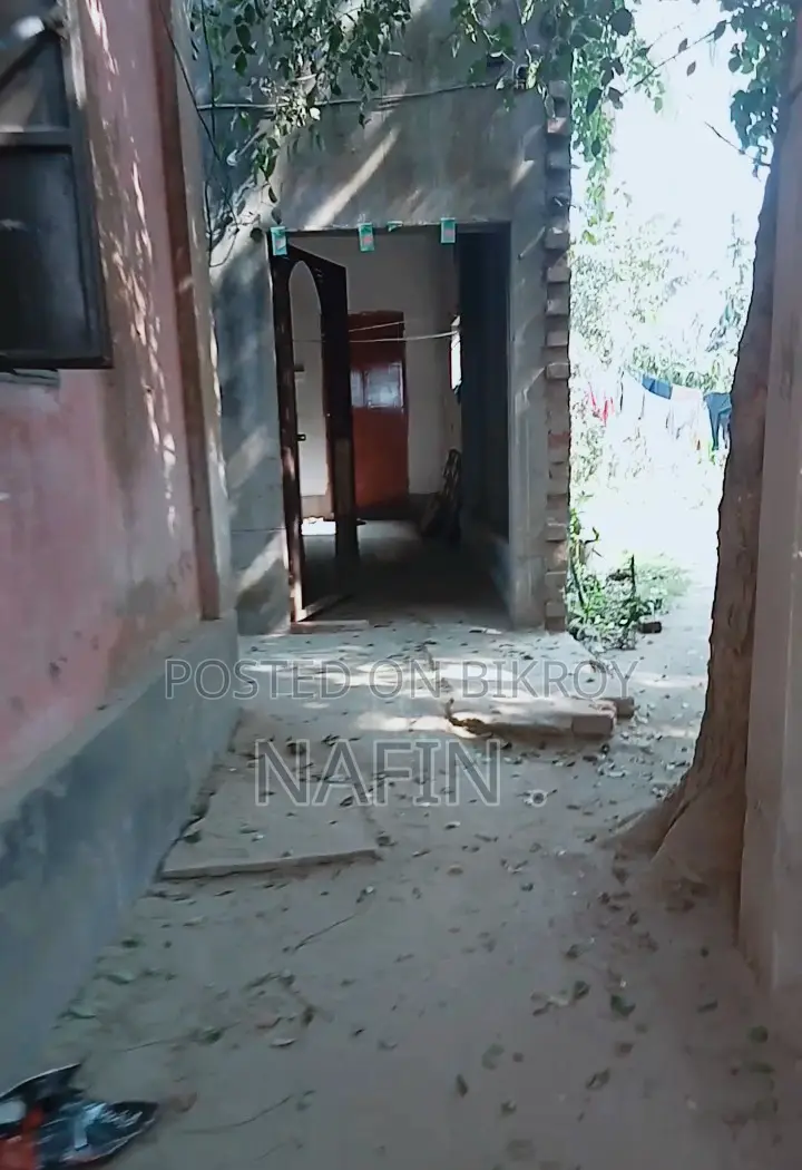 House with land for sale.