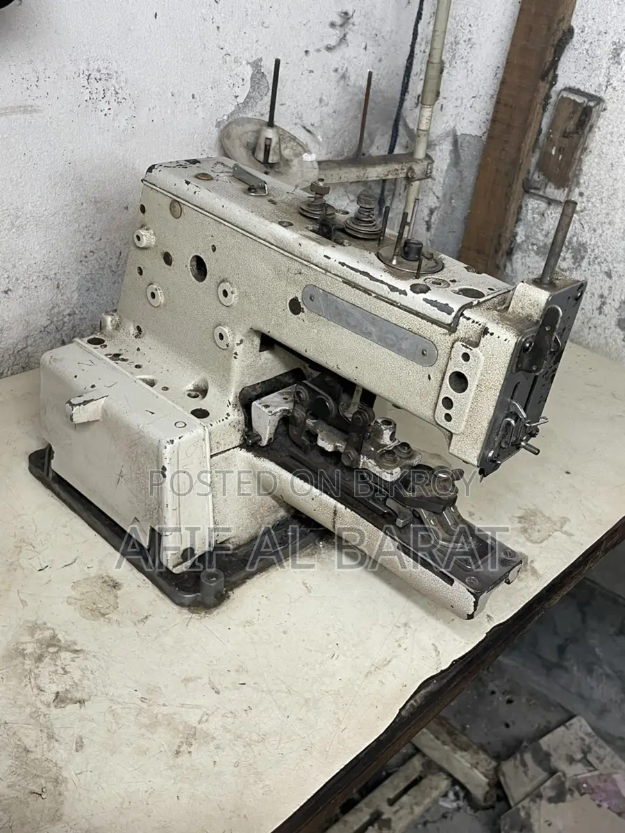 বোতাম লাগানোর মেশিন