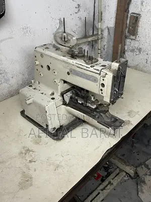 বোতাম লাগানোর মেশিন