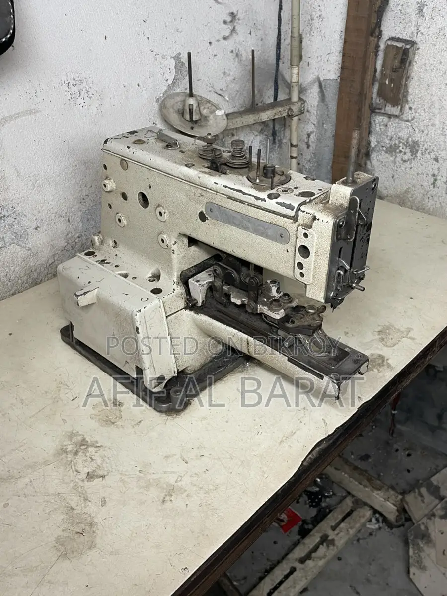 বোতাম লাগানোর মেশিন