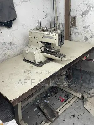 বোতাম লাগানোর মেশিন