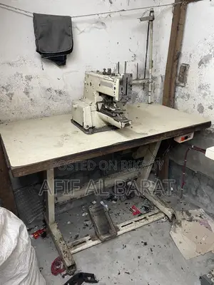 বোতাম লাগানোর মেশিন