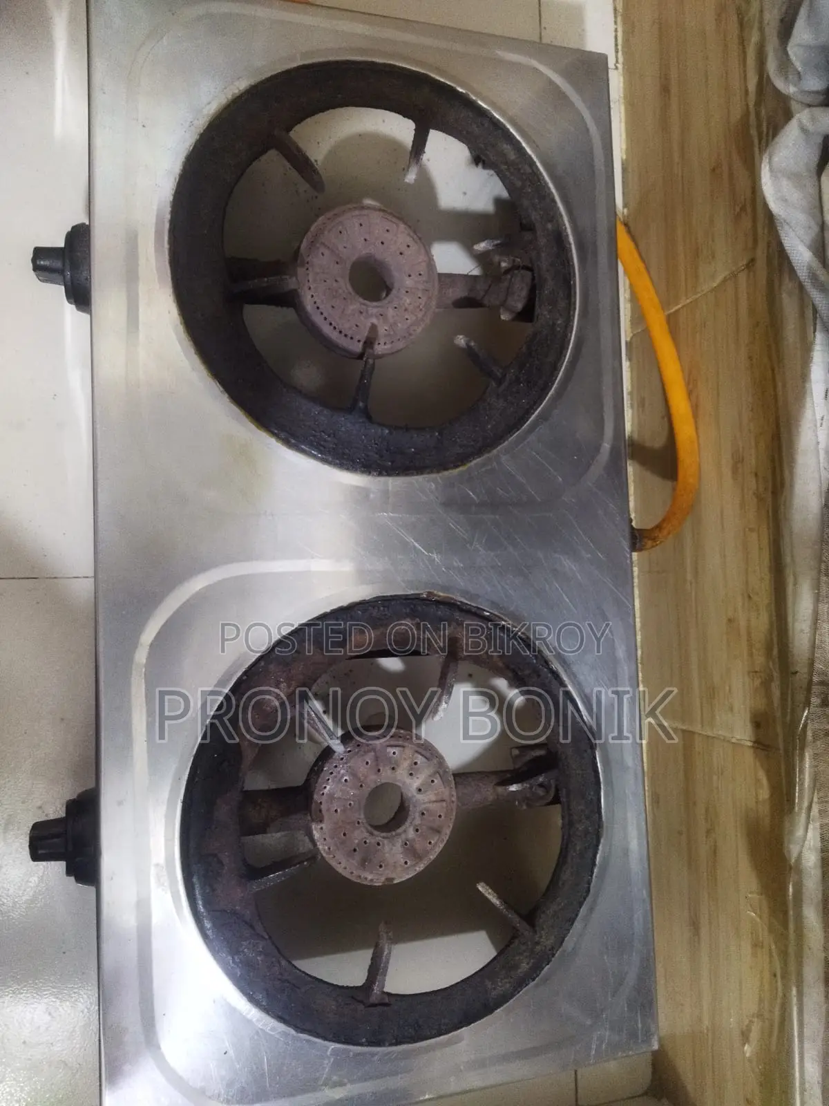 A gas stove with regulator and pipe for sale.