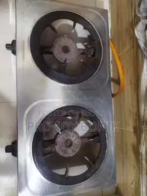 A gas stove with regulator and pipe for sale.