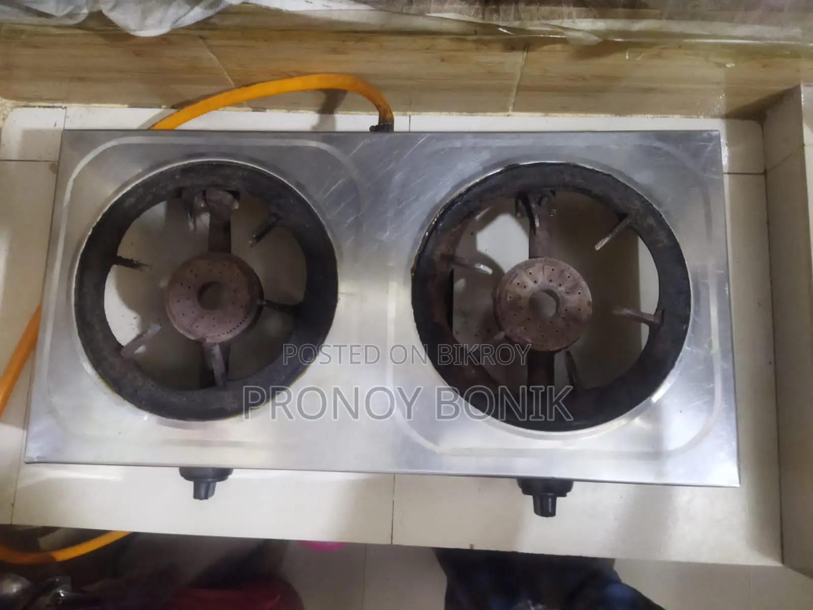 A gas stove with regulator and pipe for sale.