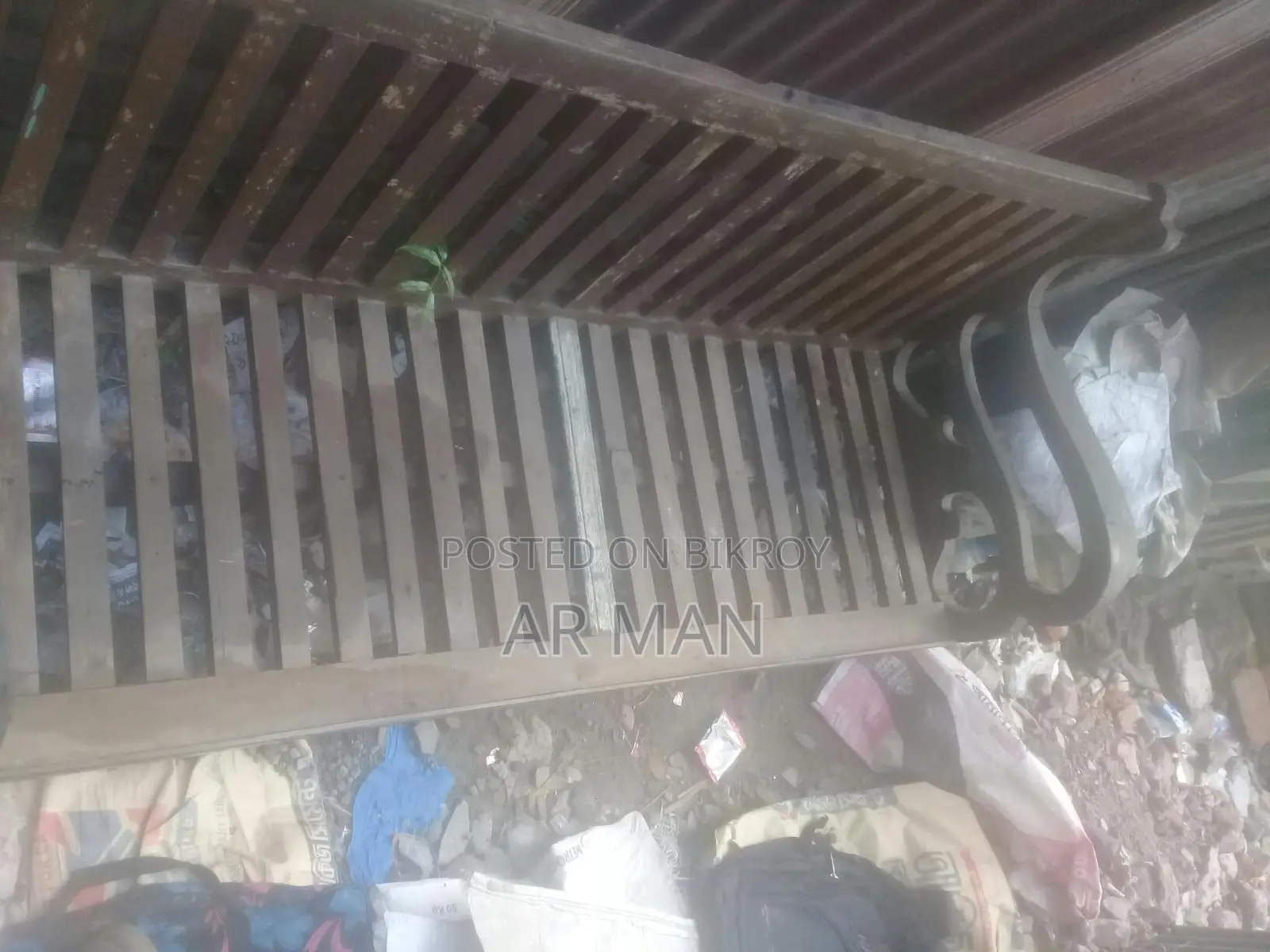 Broken Teak Sofa