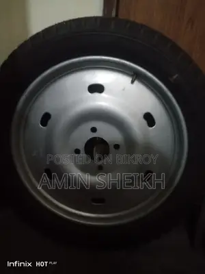 Selling one piece of new Yuboraj tire with rim
