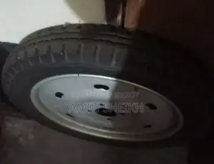 Selling one piece of new Yuboraj tire with rim