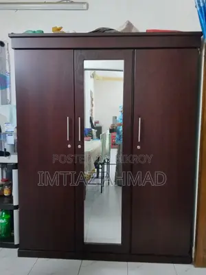 Three-door Canadian board wardrobe for sale.