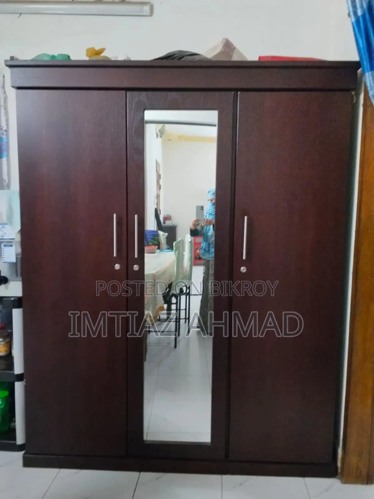 Three-door Canadian board wardrobe for sale.