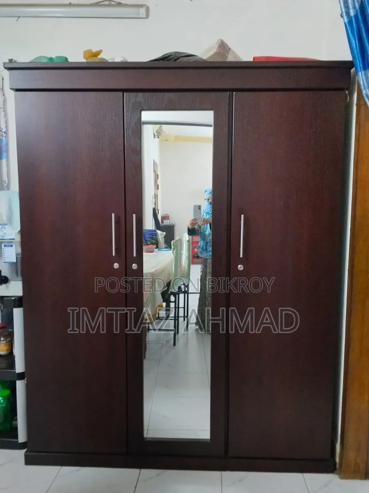 Three-door Canadian board wardrobe for sale.