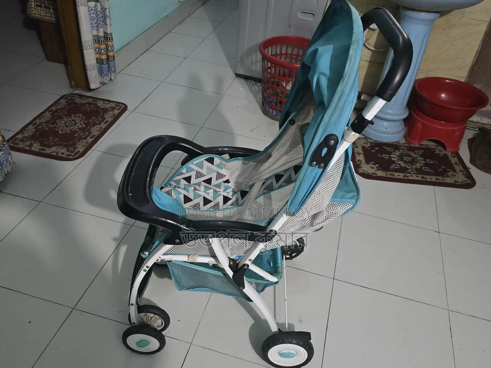 বেবি স্ট্রোলার (Baby Stroller)।