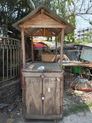 A wooden cart for tea, pitha, Chinese food, various types of snacks, etc.