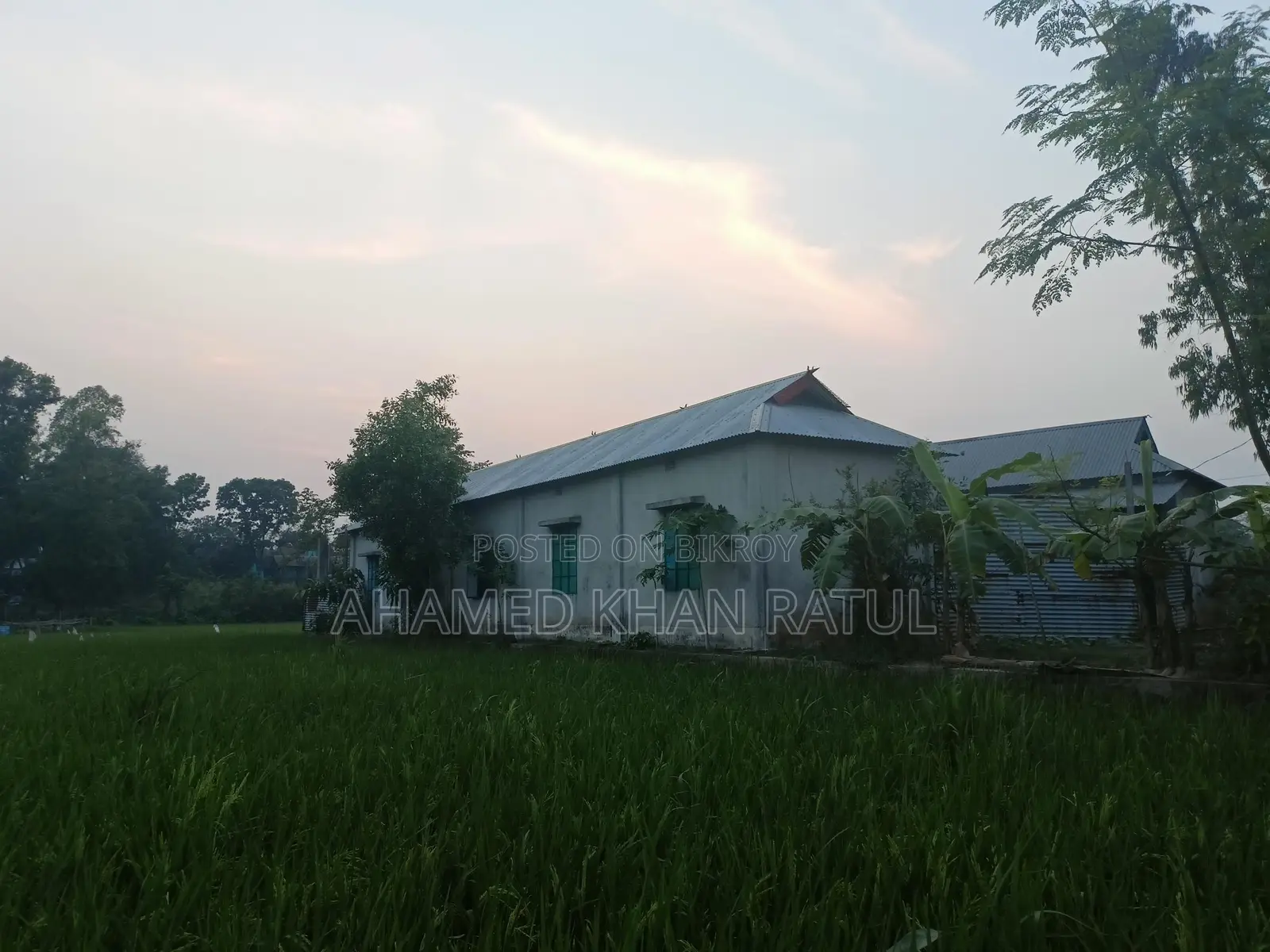 Land with house for sale.