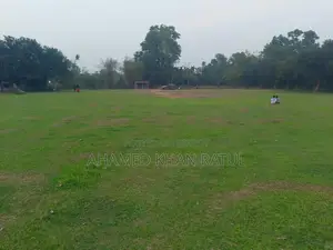 Land with house for sale.