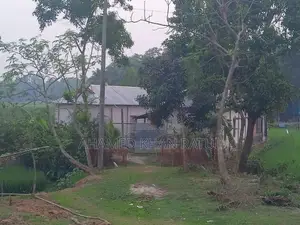 Land with house for sale.
