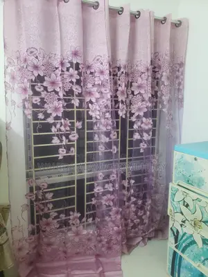 Three net curtains for sale.