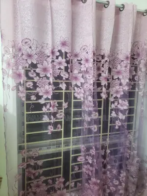 Three net curtains for sale.