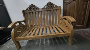 দৃষ্টিনন্দন ডিজাইনের সেগুন কাঠের দুই সিটের সোফা বিক্রয় করা হচ্ছে।