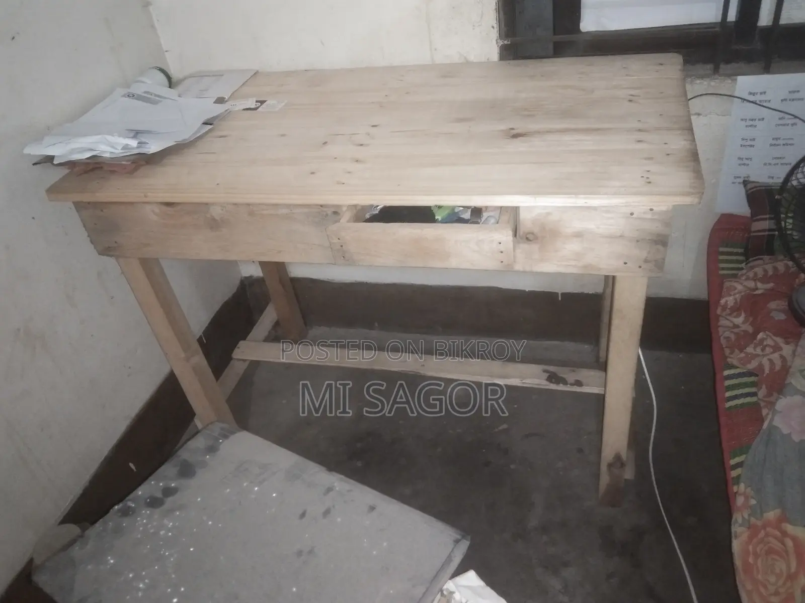 Double bed and wooden table