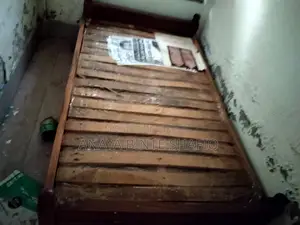 Two high-quality, sturdy wooden beds for sale.