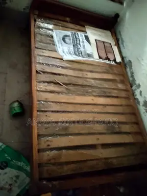 Two high-quality, sturdy wooden beds for sale.