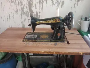 Original Singer sewing machine for sale with motor