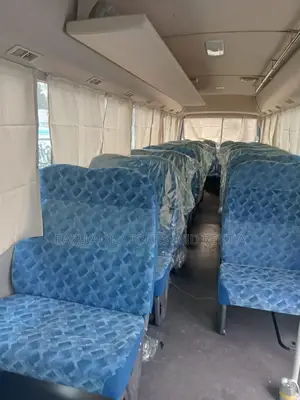 Rent a Nissan Coaster AC Bus