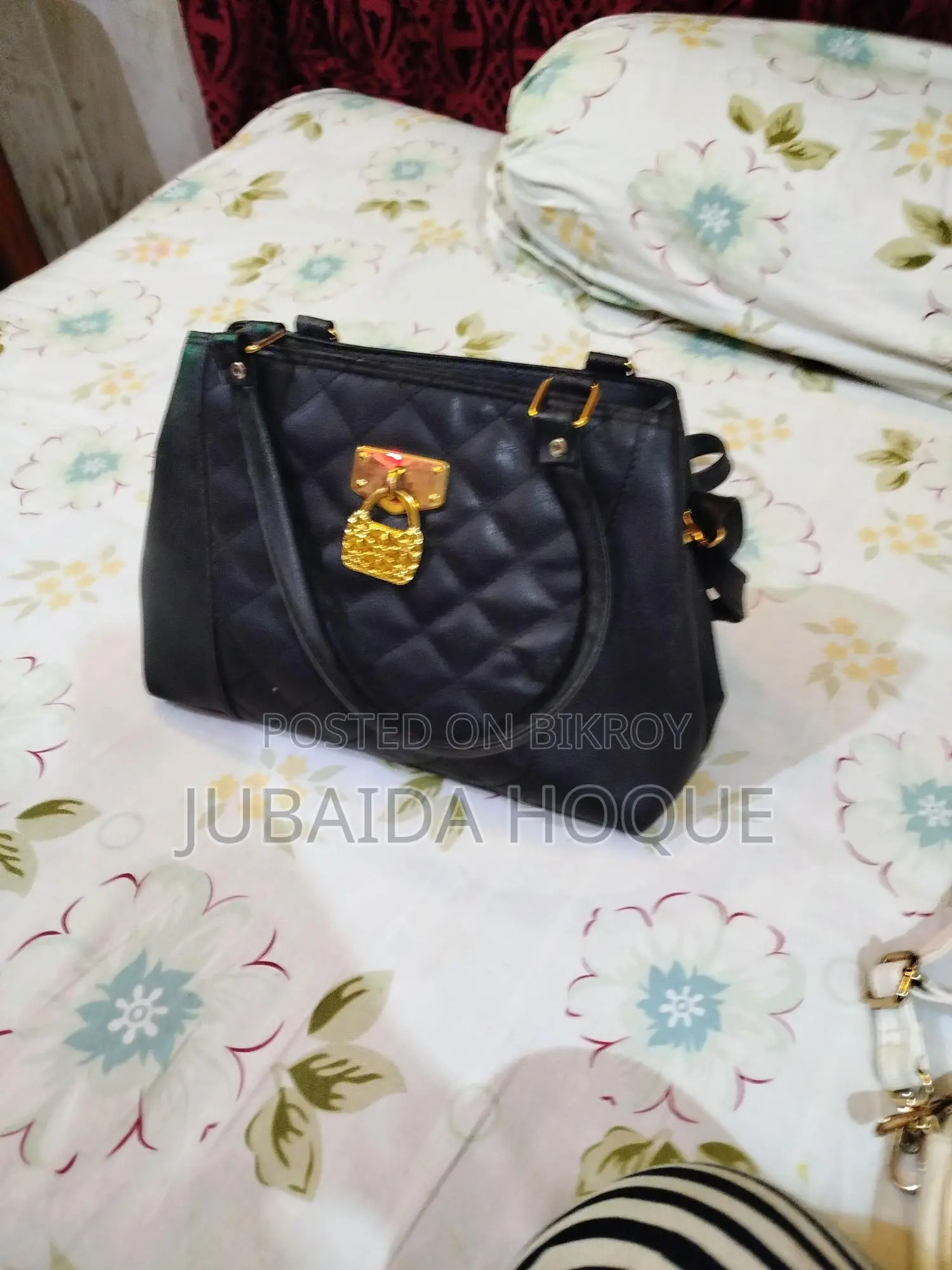 Stylish Quilted Black Handbag with Golden Lock Detail