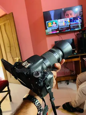 Canon 600D. With lens 50-300mm
