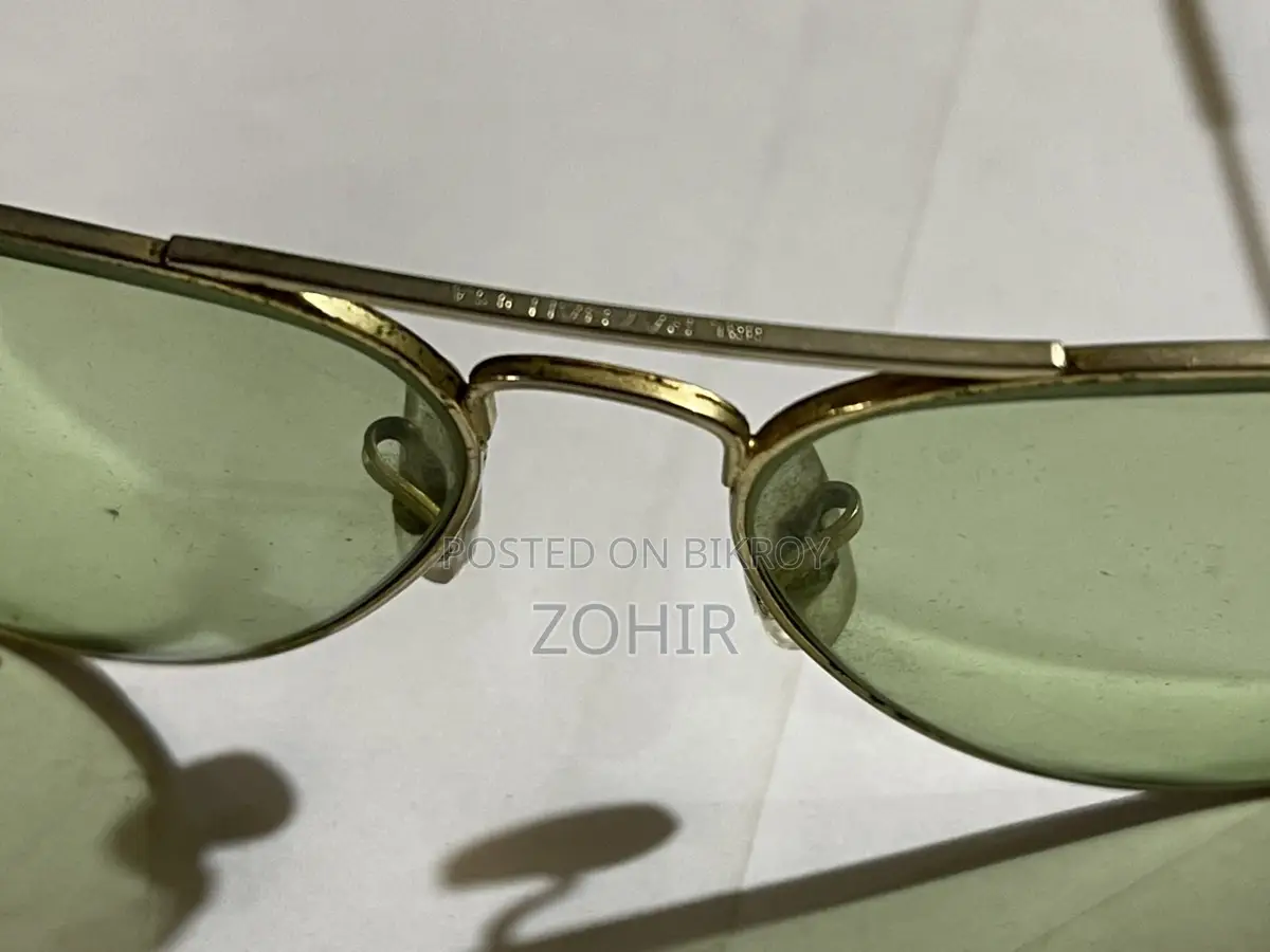 Vintage Ray Ban BL Photochromic Sunglasses 58 14 green lenses.