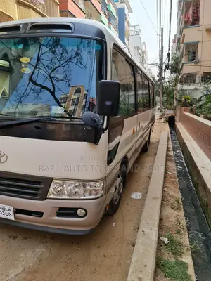নিসান কোস্টার বাস ভাড়ার জন্য