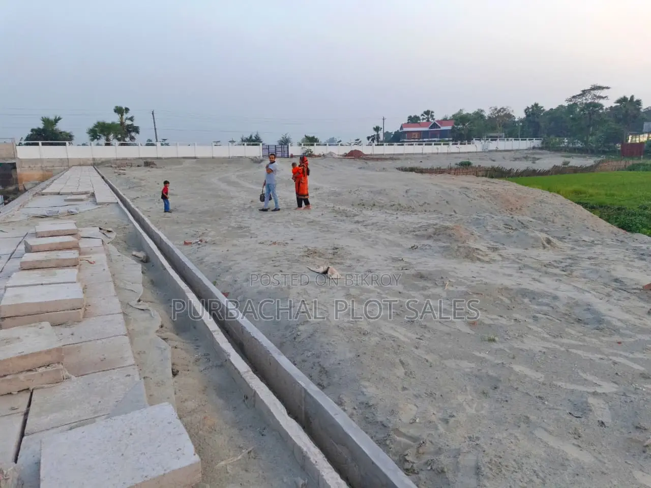 Buy a plot at Pine City after seeing visible development.