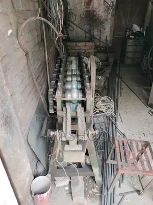 Shutter making machine and sheet cutter