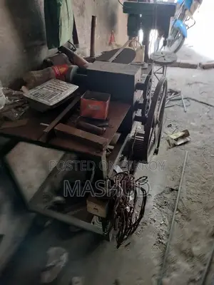 Shutter making machine and sheet cutter