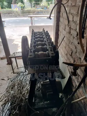 Shutter making machine and sheet cutter