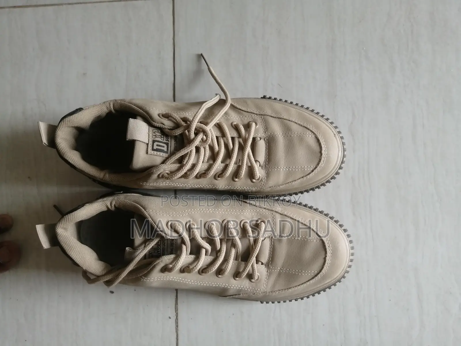 A pair of almost new sneakers for sale.