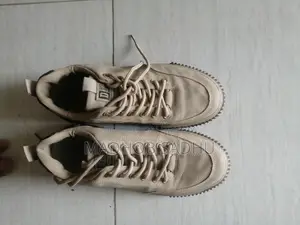 A pair of almost new sneakers for sale.