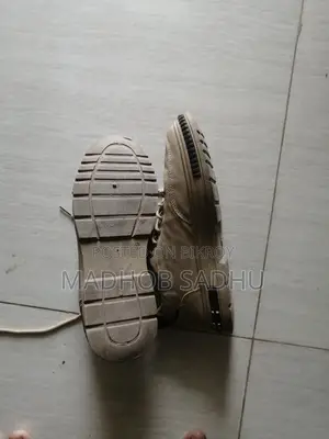 A pair of almost new sneakers for sale.