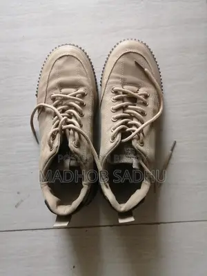 A pair of almost new sneakers for sale.